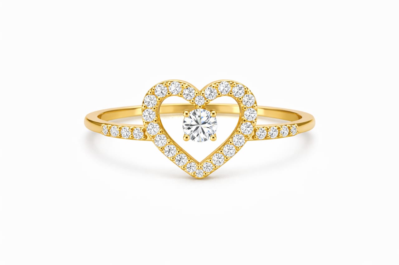 Gold heart-shaped ring with a diamond on a white background