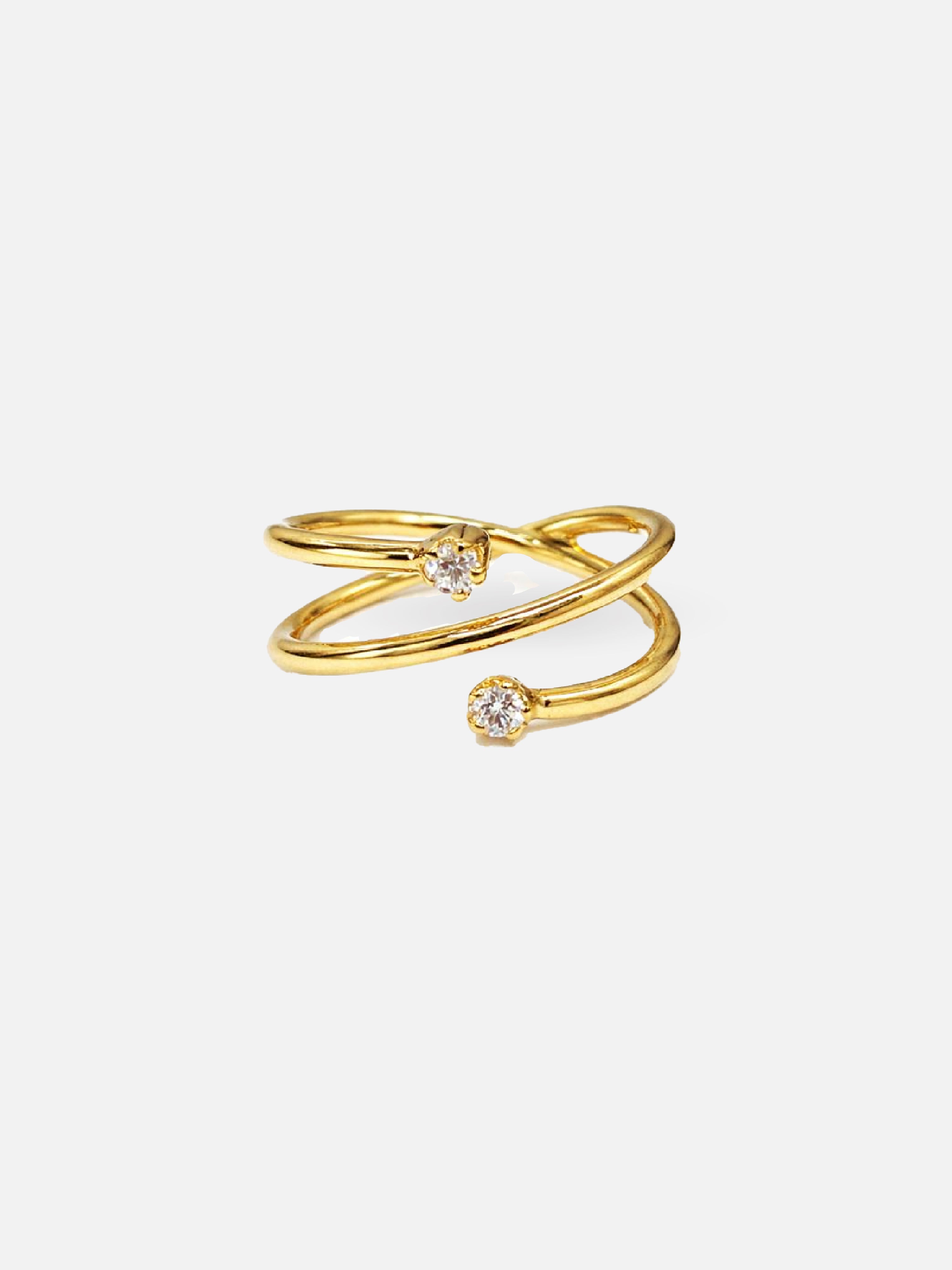 Gold ring with two small diamonds on a white background