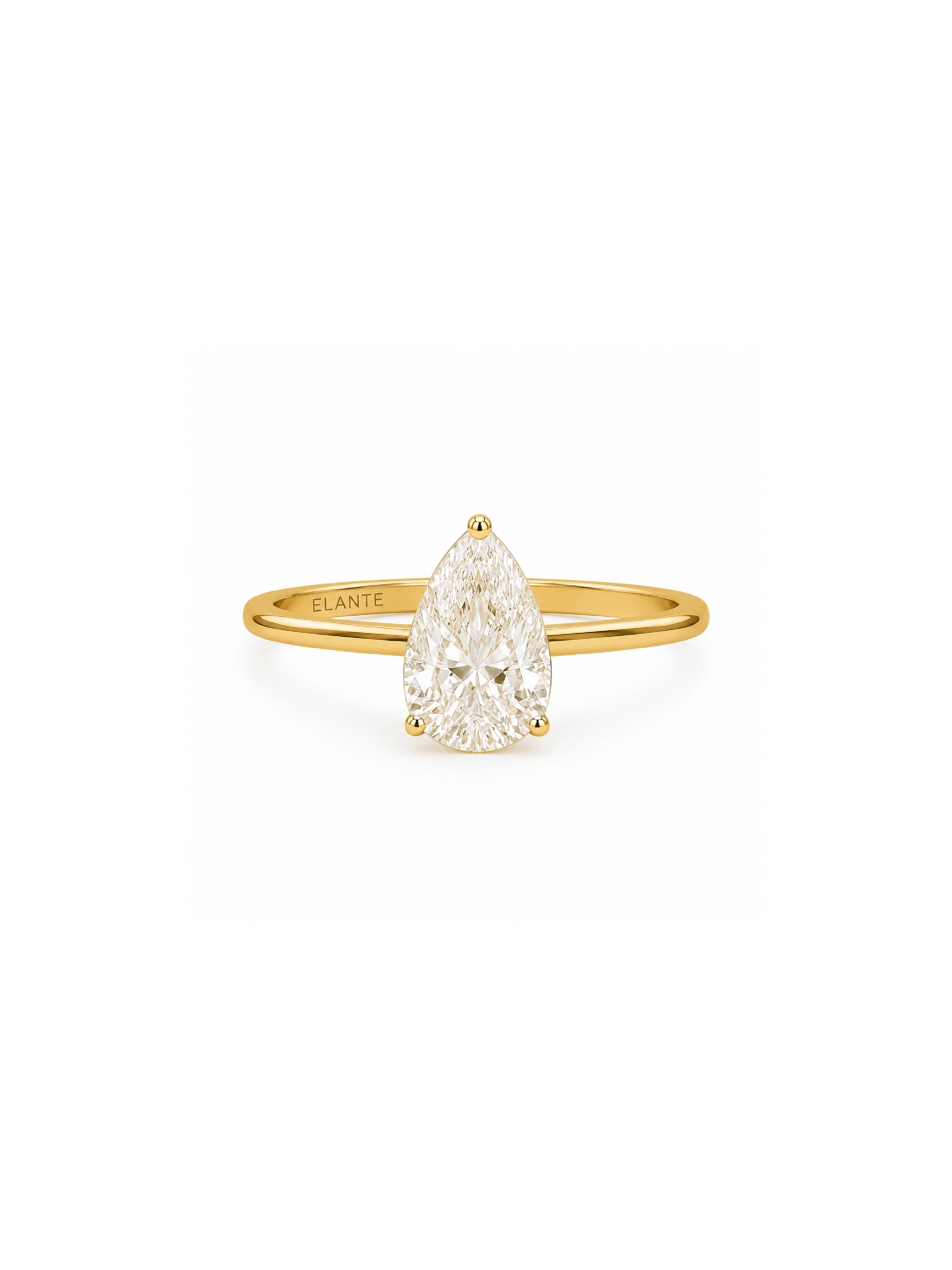 Gold ring with a pear-shaped diamond on a white background