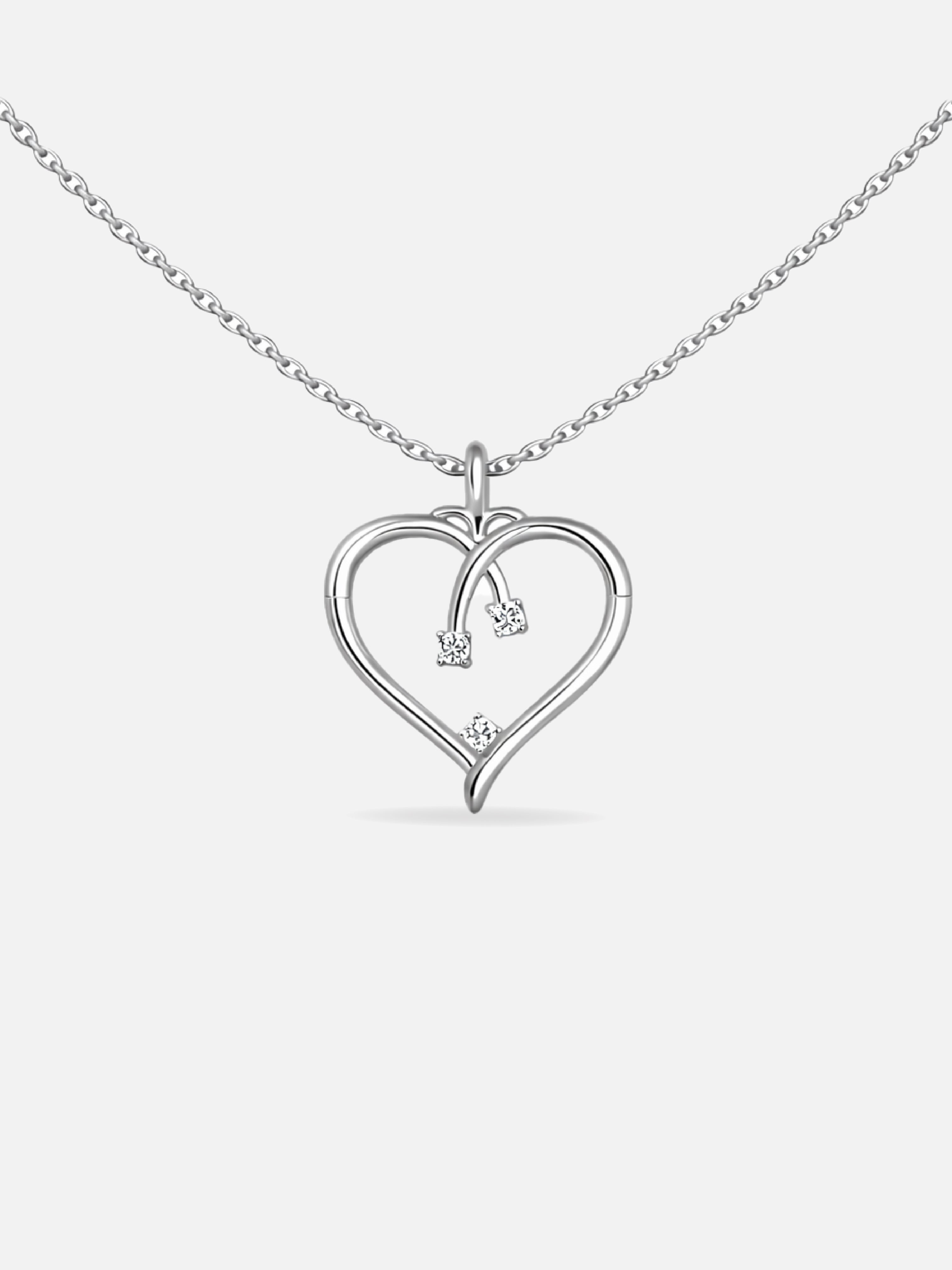 Heart-shaped pendant necklace with small diamonds on a white background